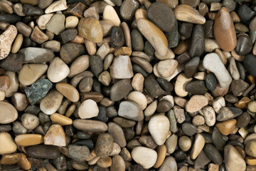 Nature wet sea pebbles background texture. natural aquarium soil. beach pebbles close up