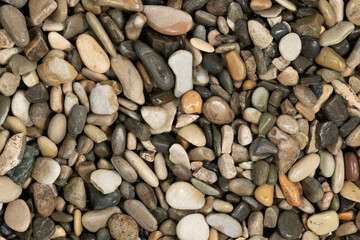 Nature wet sea pebbles background texture. natural aquarium soil. beach pebbles close up