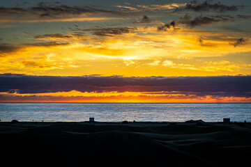 Sunrise over the Atlantic Ocean. Shot from the Dunes of Maspalomas Gran Canaria