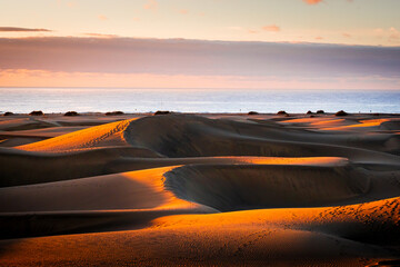 Sunrise over the Atlantic Ocean. Shot from the Dunes of Maspalomas Gran Canaria