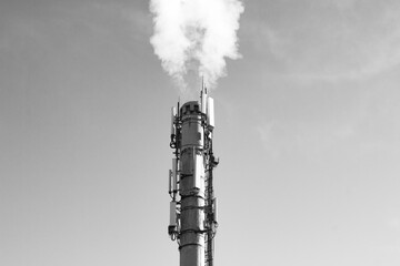 Smoke from the chimney of a plant, industrial factory. Smoke, vapors, polluting emissions from the...