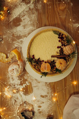 Christmas cake with oranges on table with decoration