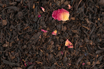 Pile leaf tea with various additives background, top view. Heap of dried tea texture