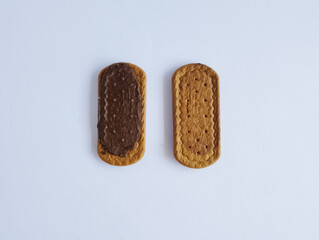 Sandwich cookies with chocolate filled, isolated on white background.