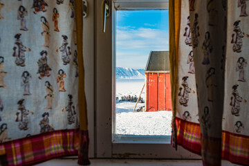 Winter Wonderland: Greenland Architecture with Snowy Sky Through Window