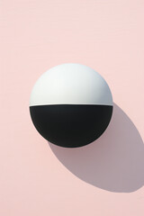 Black and white ball on a pink background.