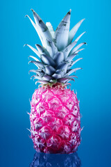 Pink pineapple on a blue background.Minimal concept.Bold colors.