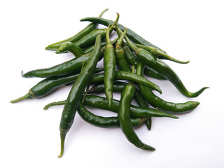 Close up of fresh green chili peppers on a white background.