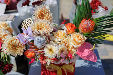 Rustic vase with a beautiful bouquet of exotic flowers