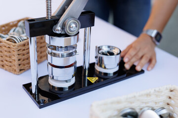 Mechanical hand press close-up and basket with icons