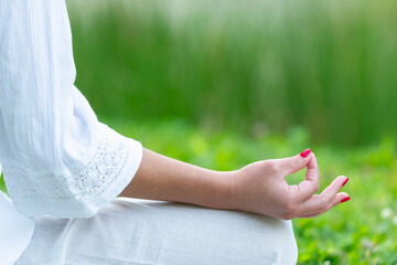 Mindfulness in detailed meditation moment. Focus in this close-up of a woman's hand during...