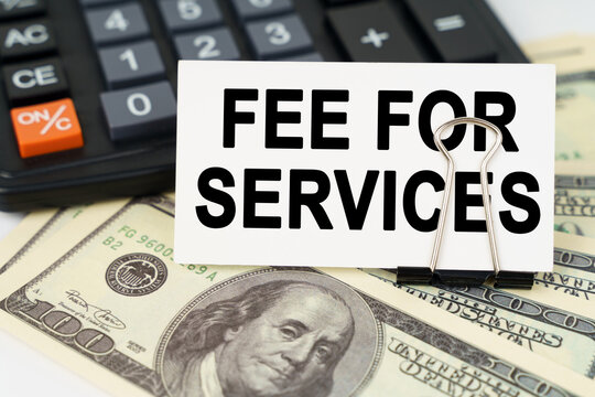 On the dollars there is a calculator and a business card with the inscription - fee for services