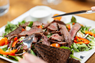 eating concept - close up of food on plate at restaurant