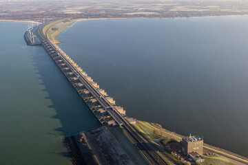 Aerial view Dutch Haringvliet dam with motorway in wintertime