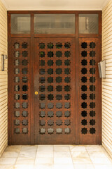 Old wooden entrance door to a house, door to a residential building, closed door, entrance to