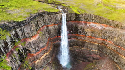 Aerial view of Hengifoss waterfall, Epic Drone Shot Mountain Waterfall.