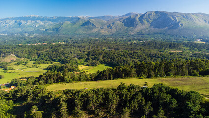 Rural view of green forests, and the Picos de Europa mountains. Asturias, Spain.