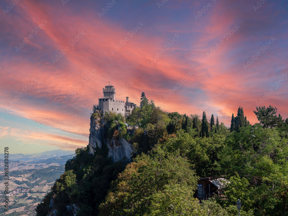 Wall mural castle in san marino at the sunset