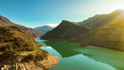 4k Aerial view of Canales Water reservoir at Sierra Nevada, Andalusia, Spain - obrazy, fototapety, plakaty