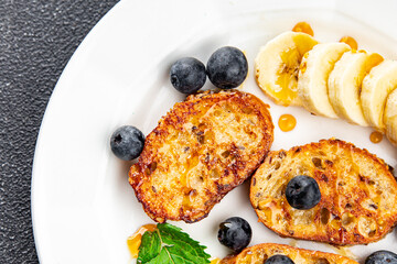 breakfast French toast sweet berries, banana pancake cooking appetizer meal food snack on the table...