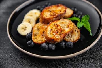 breakfast French toast sweet berries, banana pancake cooking appetizer meal food snack on the table...