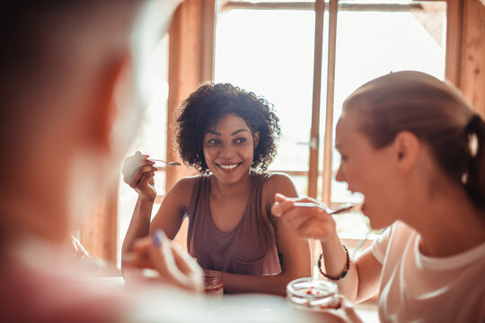 Friends Sharing a Laugh over Breakfast