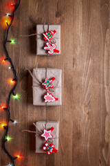 Christmas gifts on wooden background in vintage style
