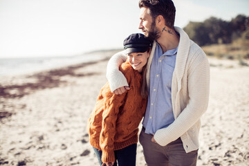 Couple Enjoying a Romantic Walk on the Beach