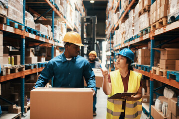 Warehouse Workers and Supervisor Coordinating Operations