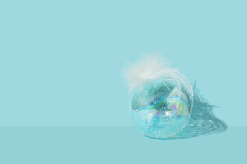 Christmas bubble glass transparent balls empty inside on blue background. Festive decoration objects. 