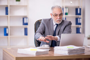 Old male employee and too much work in the office