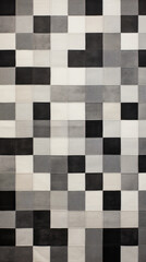 Fototapeta premium A pattern of black and grey squares arranged in a quilt-like pattern