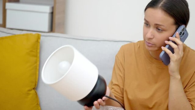 emotional woman, let down by an mistake delivery, discusses return options with customer service, box exposed in her home.