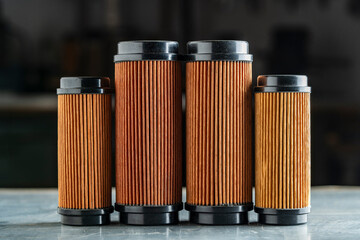 Air filters for engine car on grey background, closeup. Auto parts accessories for retro cars