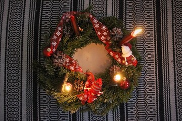 Christmas wreath, red decorations and candles