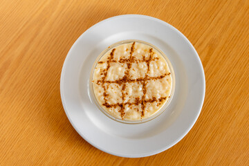 Delicious Portuguese rice pudding, a creamy traditional dessert topped with cinnamon, perfect for a sweet treat. Authentic taste captured!