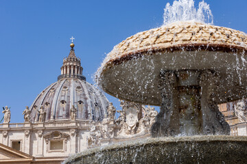 one of the two fountains on St. Peter's Square in Vatican City, created by Carlo Maderno...