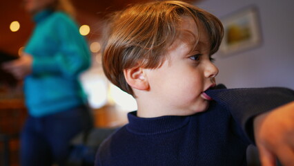 Boredom Bites, Small Boy Pulling Sleeve with Teeth, Idle at Restaurant