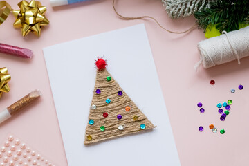 DIY Christmas Design. Greeting Card with christmas tree. Scandinavian Holidays Mockup. christmas decorations. Flat lay for Merry Christmas or Happy New Year.