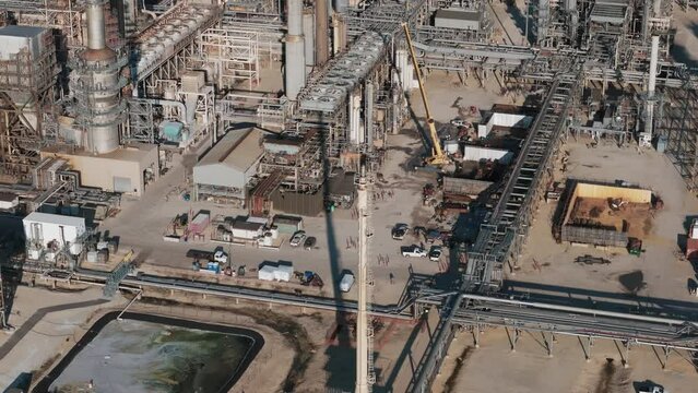 Aerial footage of Oil and gas petrol fuel refinery petrochemical plant. Wide shot