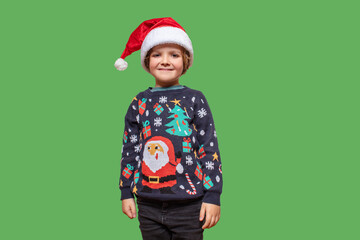 Emotional Christmas boy in a holiday clothes . Happy child on a color back . Happy New Year. Merry Christmas! The child is waiting for the winter holidays. Boy shocked that winter holidays is coming.