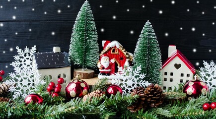 Christmas card, on a wooden background, Santa Claus's house in a fabulous, New Year's, winter forest, white snowflakes and fir branches.  Religion holiday concept New Year and Christmas.