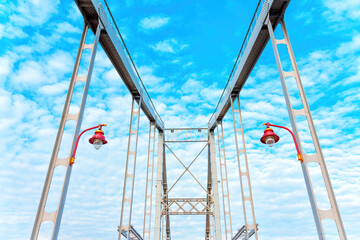 Bridge Constructions with Red Lanterns Against Blue Sky