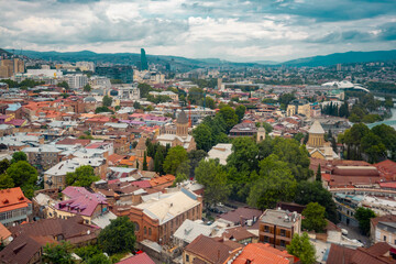 Fototapeta premium The Kura river, The Bridge of Peace, The Holy Trinity Cathedral of Tbilisi, churches and the magnificent view of Tbilisi city from the cable car.