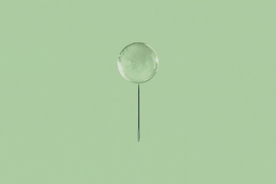 Sewing Needle and Bubble. Concept Image.