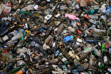 hundreds of glass bottles waiting to be recycled