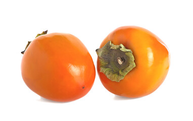 Two persimmon fruits isolated on a white background.