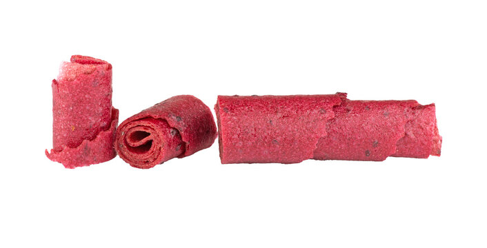 Delicious healthy fruit roll-ups isolated on a white background. Fruit pastille slices.