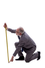 Old businessman holding tape measure isolated on white