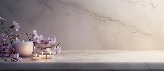  In the corner of the room adorned with white marble flooring, glistening wax candles cast a soft glow, illuminating a vase of delicate white lilacs and smooth stones. © AkuAku